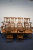 A MODERN OAK EXTENDING DINING TABLE, with two additional leaves, raised on four legs, united by a