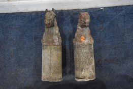 A PAIR OF COMPOSITE HORSE HEAD FINIALS, with the cylindrical support, overall height 54cm x finial