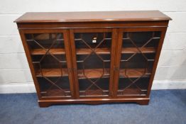 A 20TH CENTURY MAHOGANY BOOKCASE, with three glazed doors, raised on bracket feet, width 138cm x