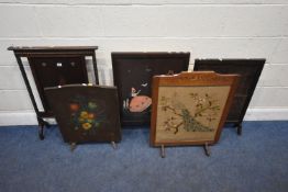 FIVE EARLY 20TH CENTURY OAK FIRE SCREENS, varying in shape, size, style, two with tapestry
