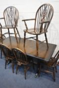 A 20TH CENTURY OAK RECTANGULAR TABLE, raised on trestle style legs, united by stretchers, length