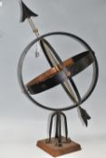 AN ARMILLARY SPHERE in a painted metal and copper armillary sphere mounted on a square wooden