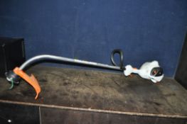 A STIHL FS50C PETROL STRIMMER total length 153cm, condition report: engine pulls freely but hasn't