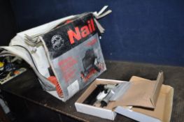 A PERFORMANCE POWER PNEUMATIC NAILING KIT with compressor, pipework and nail gun (PAT pass and