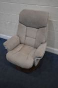 AN OATMEAL SWIVEL RECLINING ARMCHAIR, width 74cm x depth 84cm x height 101cm, condition report: