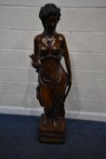 A LARGE RESIN FIGURE POSSIBLY IN THE FORM OF THE SCANTILY CLAD GREEK GODDESS ARTEMIS, with a bow,