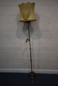 A BRASS TELESCOPIC OIL LAMP, that has been converted to electric, raised on three cabriole legs