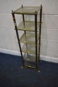 A BRASS SIX TIER WHATNOT, the glass shelves with canted corners, raised on shaped feet, height