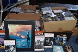 FOUR BOXES OF CDS AND VHS CASETTES WITH THREE RACKS to include a 'What Dreams May Come' VHS