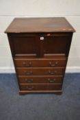 AN EARLY 20TH CENTURY MAHOGANY TALLBOY, the double cupboard doors enclosing three linen slides, over