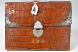 A CROCODILE SKIN AND WHTE METAL JOURNAL CASE, featuring white metal hardware that is hallmarked on
