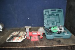 A HITACHI M12VE 1/2in ROUTER in case, a Power Devil bench grinder and a Mastergrip rotary tool and