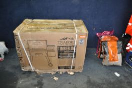 A TRAEGER TFB85WLEC TIMBERLINE 850 WOOD FIRED GRILL still packaged in tatty and water damage box,
