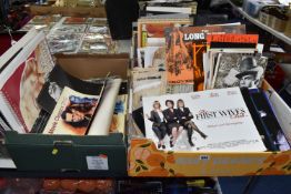 THREE BOXES OF FILM AND TV EPHEMERA to include calendars, lobby cards, a movie poster book,