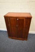 A MODERN HUANGHUALI BREAKFRONT COCKTAIL / DRINKS CABINET, the hinged lid with a mirror plate, four