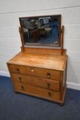 AN EARLY 20TH CENTURY OAK DRESSING CHEST, with a rectangular bevelled edge mirror, atop a base