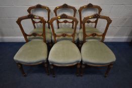 A SET OF SIX WALNUT DINING CHAIRS, with foliate carved details, condition report: general signs of