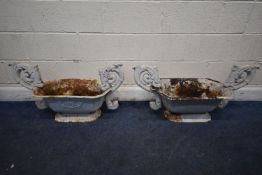 A PAIR OF WHITE PAINTED CAST IRON PLANTERS, with large foliate handles, width 94cm x depth 35cm x