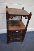 AN EARLY 20TH CENTURY MAHOGANY CABINET, with a shelf raised on turned supports, over a single glazed
