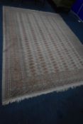 A LARGE RECTANGULAR PAKISTANI BOKHARA RUG, with 186 medallions, surrounded by a multi-strap