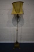 A BRASS TELESCOPIC OIL LAMP, that has been converted to electric, with a reeded pillar, raised on