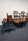 A REGENCY MAHOGANY TWIN PEDESTAL DINING TABLE, with two additional leaves, the six splayed legs with