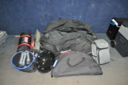 A COLLECTION OF CAMPING EQUIPMENT in a Reebok rolling sports bag containing a Colemans Coastline 2