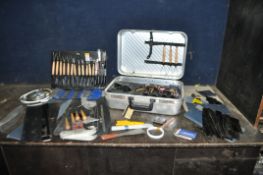 A 1980s ALUMINIUM TOOL CASE CONTAINING POTTERY AND CRAFTING TOOLS including scrapers, radius