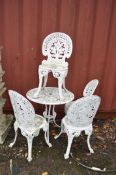 A MODERN PAINTED CAST ALUMINIUM GARDEN TABLE 68cm in diameter and four matching chairs. Condition