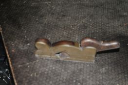 A VINTAGE BRASS AND HARDWOOD REBATE PLANE with an 8in steel foot Condition Report; blade tensioner