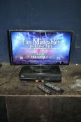 A SAMSUNG UE28F4000 28in TV with remote and a Toshiba DVD/VHS recorder with remote (both PAT pass