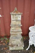 A MODERN CONCRETE GARDEN ORNAMENT in the form of a pagoda, constructed in 5 sections, total height