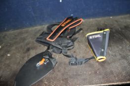 A STIHL STRIMMER HARNESS and a Stihl tool holder (2)