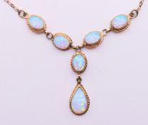 A 9 ct gold opal pendant necklace.