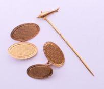 A pair of 9 ct gold cufflinks and a 9 ct gold pin formed as a shark/fish. The pin 1.5 cm wide. 5.