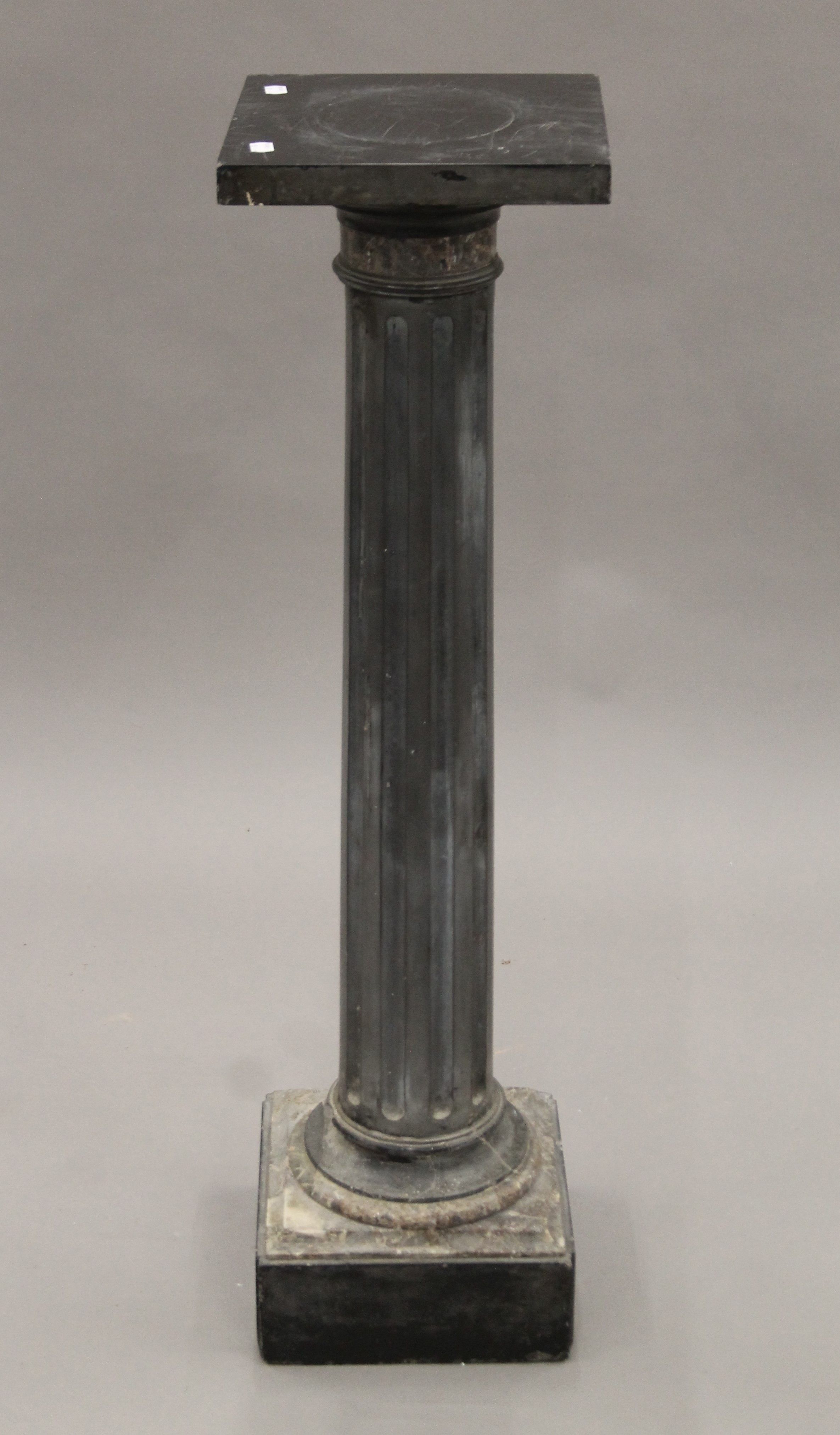 A 19th century slate and marble pedestal column. 107 cm high.