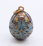 An enamel egg shaped pendant. 2.5 cm high.