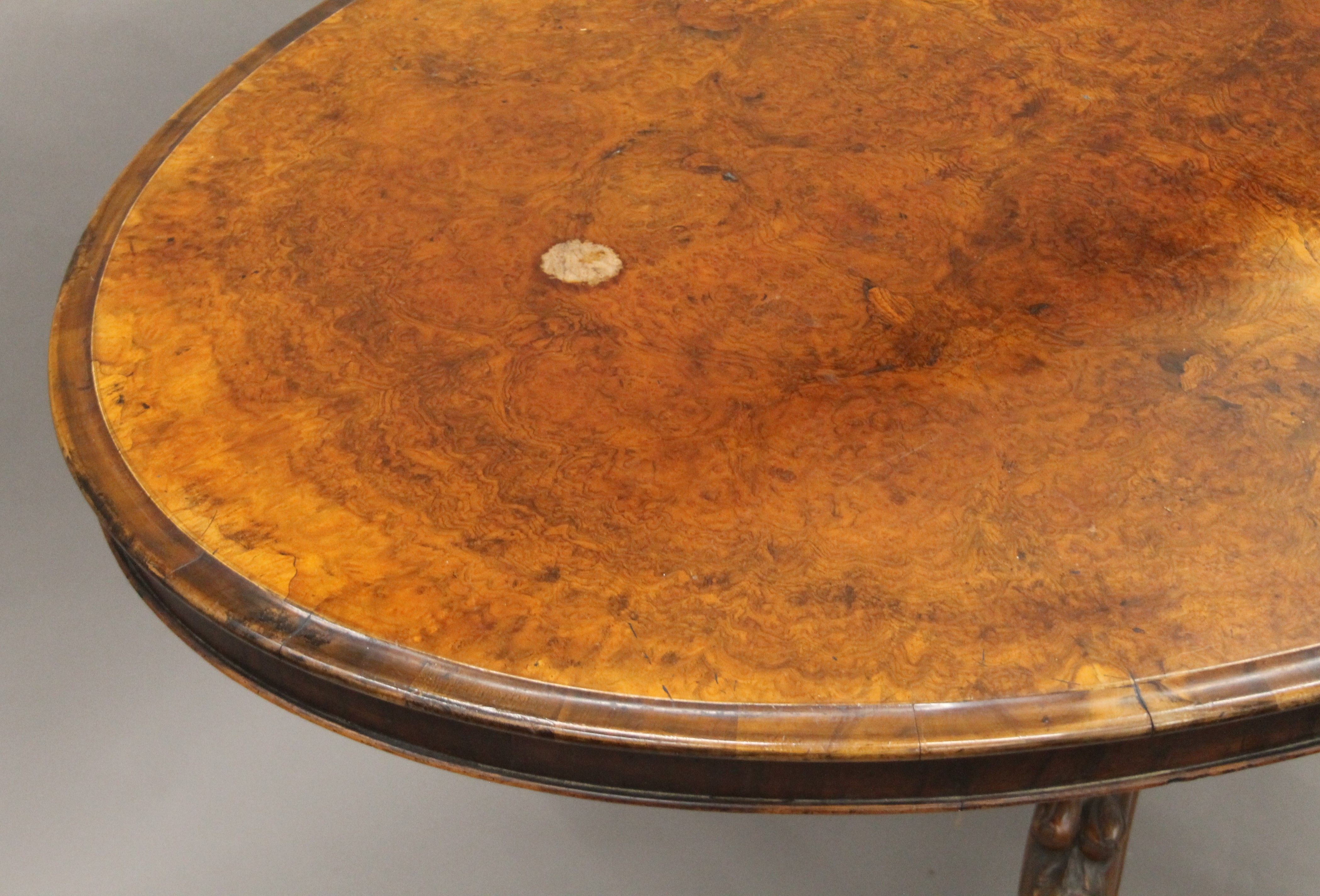 A Victorian burr walnut loo table. 135 cm long. - Image 2 of 6