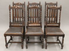 A set of six early 20th century oak barley twist chairs. 46 cm wide, 105 cm high.