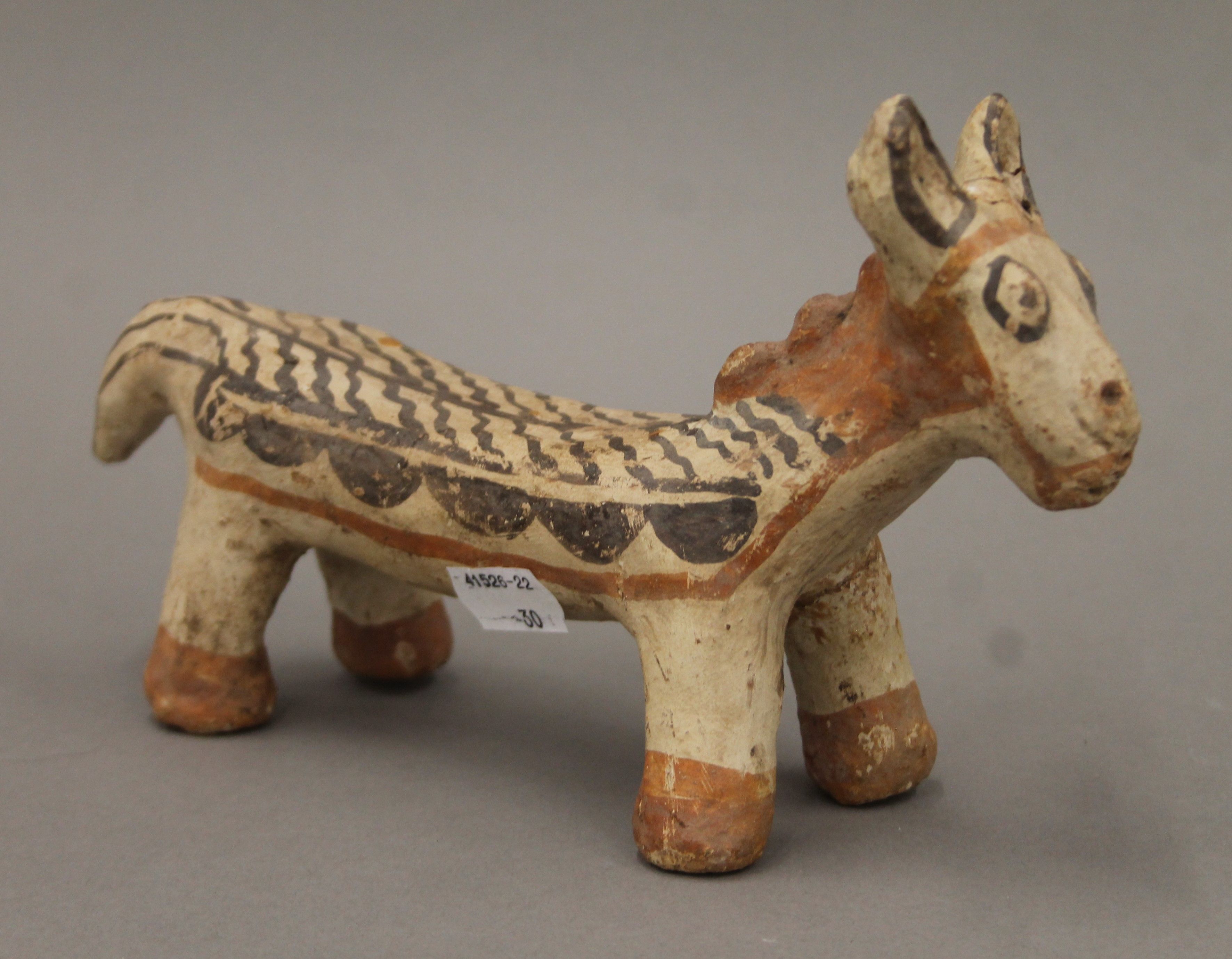 An antique Greco-Romano terracotta painted anamorphic model. 24 cm long.