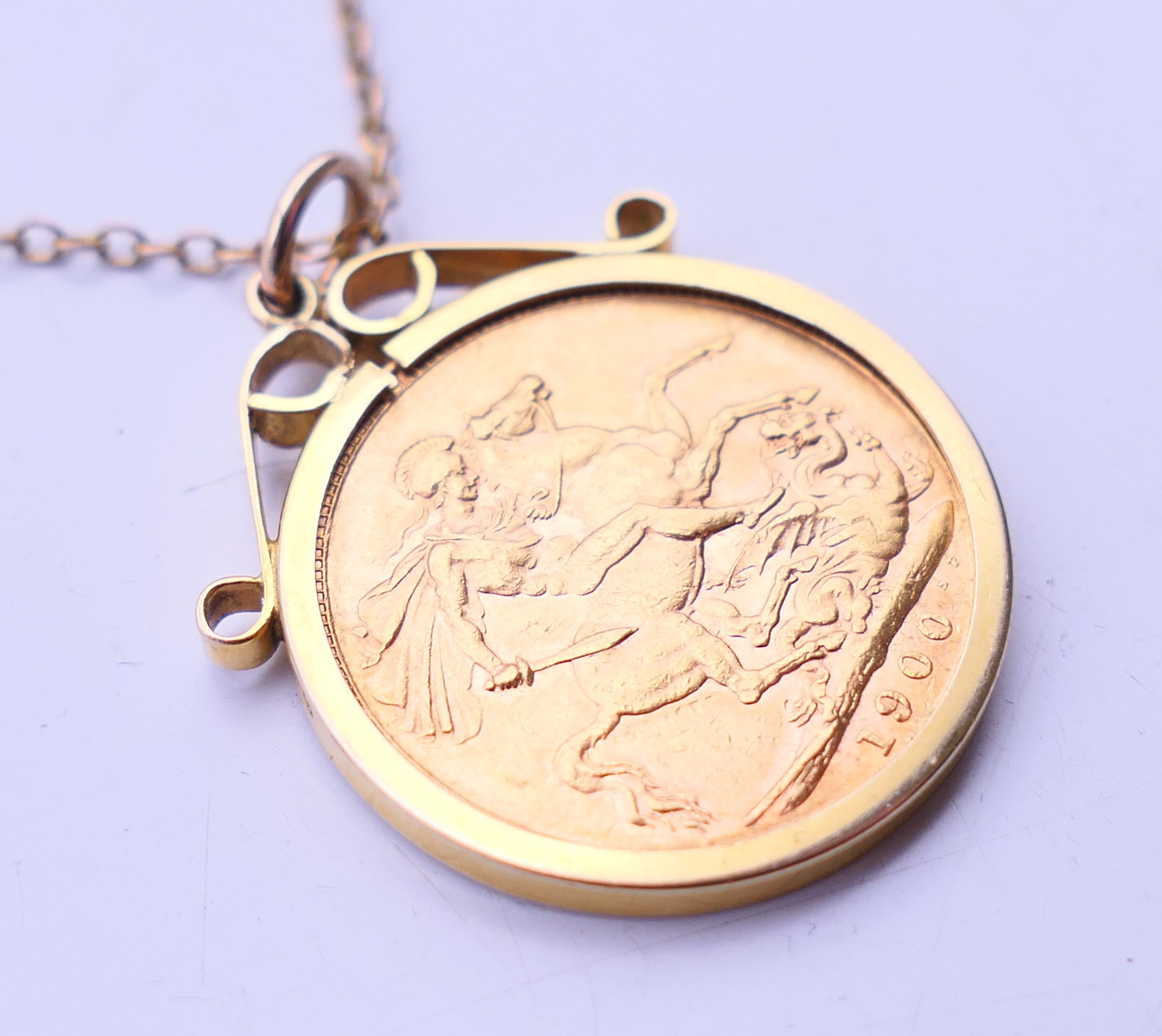 A 1900 sovereign pendant on a 9 ct gold chain. Pendant 2.3 cm diameter, chain 60 cm long. 12. - Image 2 of 5