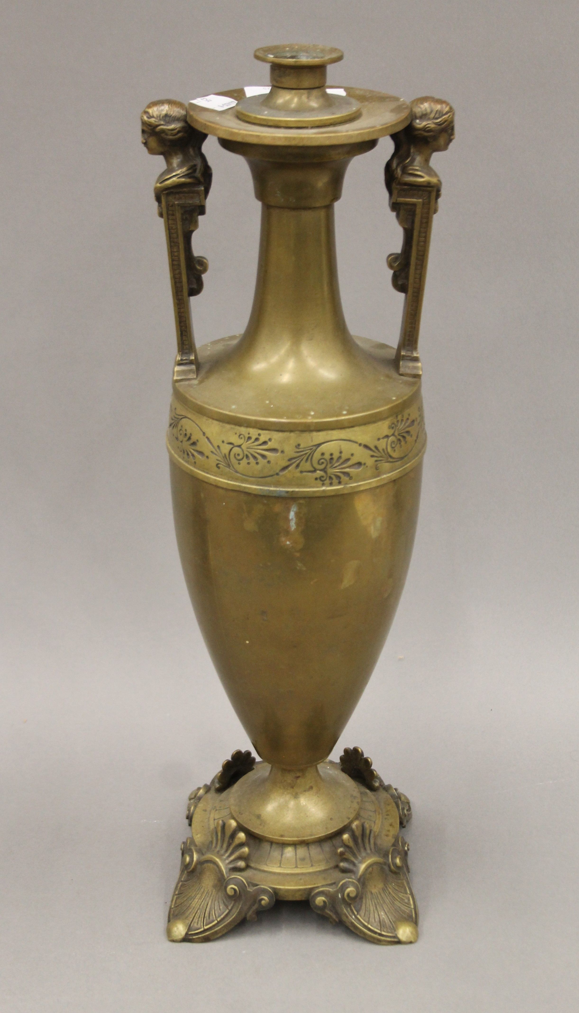 A 19th century bronze table lamp formed as a classical urn. 47 cm high.