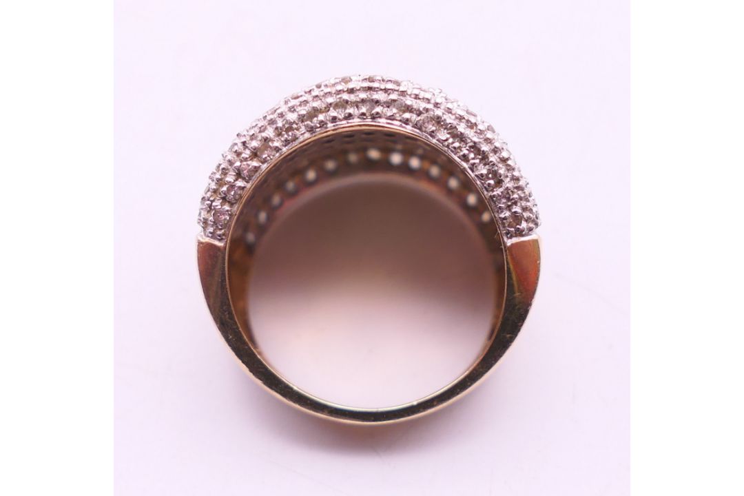 A 9 ct gold multi-stone diamond ring. - Image 6 of 6