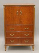A 20th century mahogany side cabinet and a matching pair of pot cupboards. The former 79 cm wide.