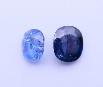 Two loose sapphires. Dark blue sapphire 1 cm high, light blue sapphire 8 mm high.