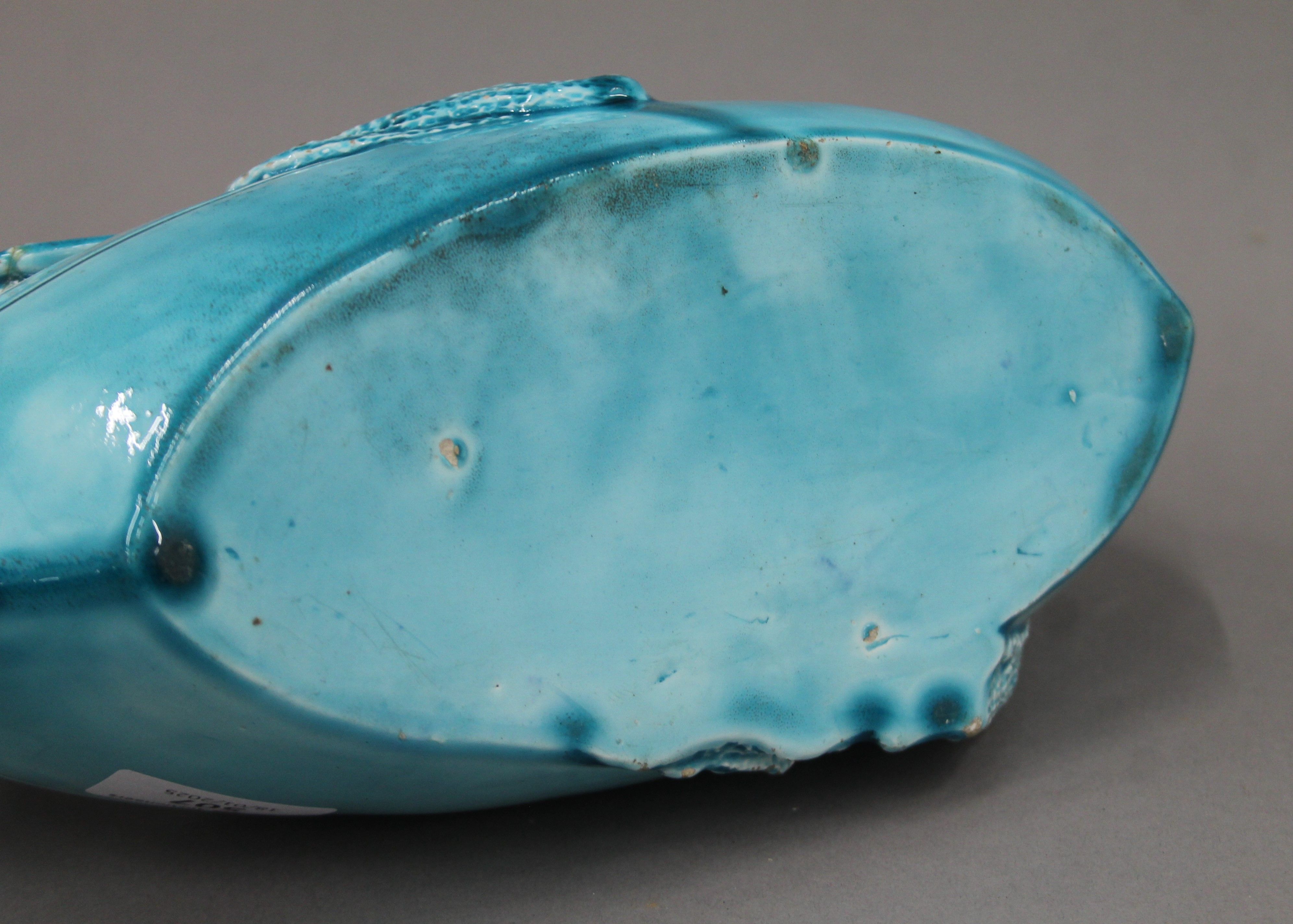 A 19th century blue ground pottery centrepiece formed as clowns in a boat. 31 cm long. - Image 6 of 8