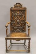 A 19th century carved walnut open armchair. 63 cm wide.