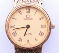 A ladies Omega De Ville wristwatch. Dial 2 cm diameter.