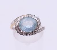 An 18 ct white gold, aquamarine and diamond ring. 4.5 grammes total weight. Ring size P/Q.