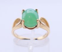 A 14 K gold and jade ring. 3.7 grammes total weight. Ring size N/O.